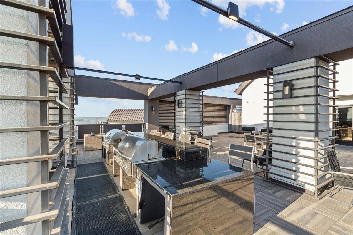 717 Riverside Drive, Unit 906 Memphis, TN 38103 - Photo 20 of 24 View of patio with area for grilling and exterior kitchen