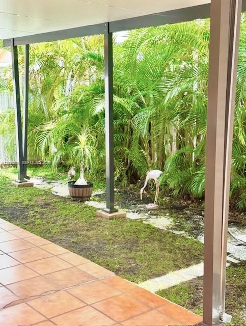 6527 West 22nd Lane Hialeah, FL 33016 - Photo 17 of 18 a view of a garden from a window