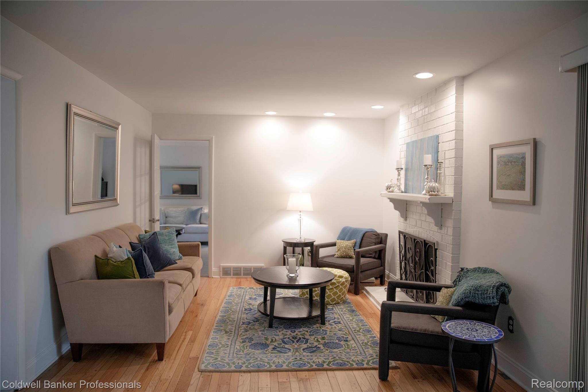 Comfortable family room with gorgeous wood floors.