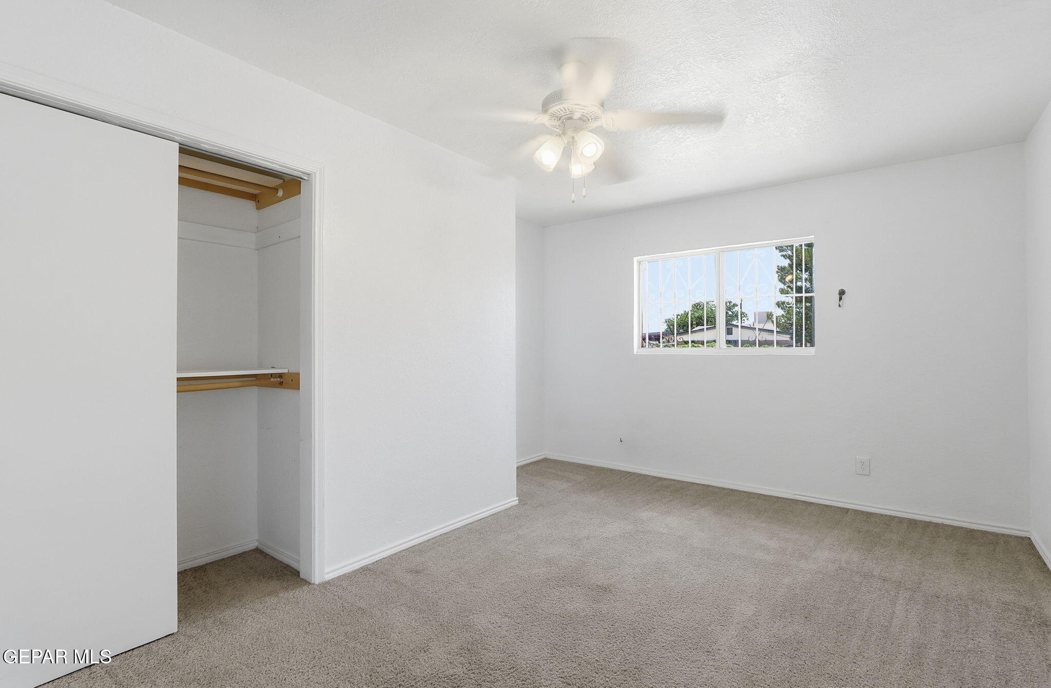 496 Telop Road El Paso, TX 79927 - Photo 6 of 12 a view of an empty room with a fan