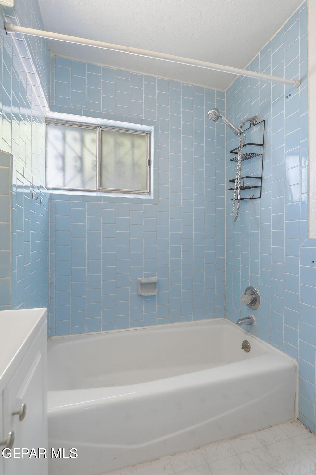 496 Telop Road El Paso, TX 79927 - Photo 9 of 12 a bathroom with a bathtub and shower
