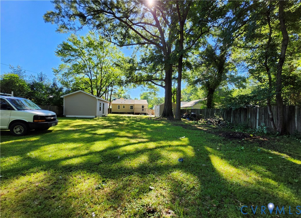 2718 Stacie Road Richmond, VA 23224 - Photo 50 of 50 Expansive green lawn with mature trees and perimet