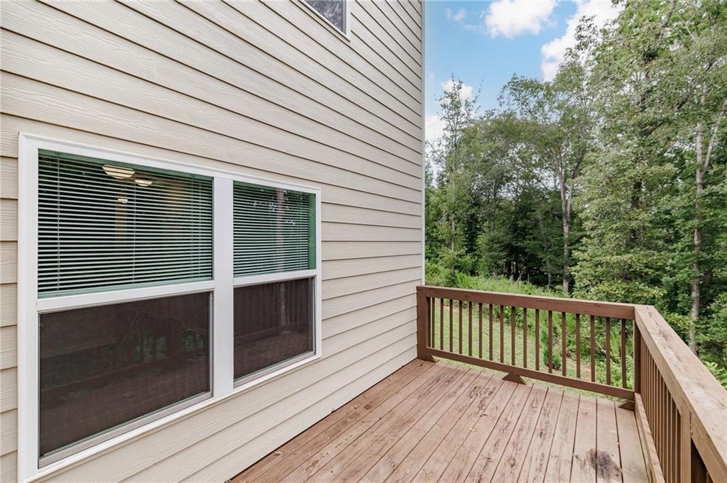 103 Three Rivers Court Hull, GA 30646 - Photo 18 of 40 a view of a balcony with wooden floor