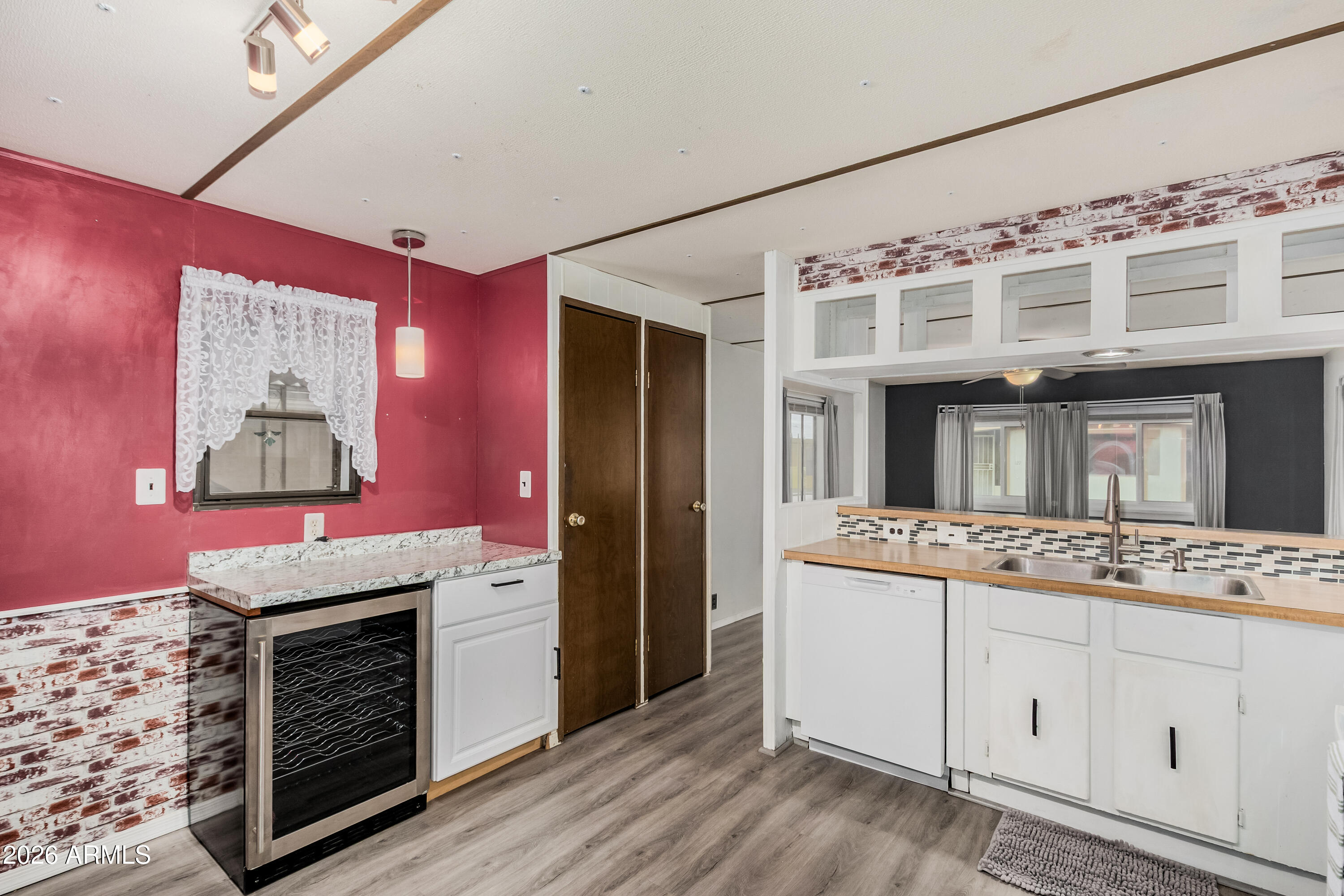 9302 East Broadway Road, Unit 122 Mesa, AZ 85208 - Photo 14 of 30 a view of cabinets with window and fireplace