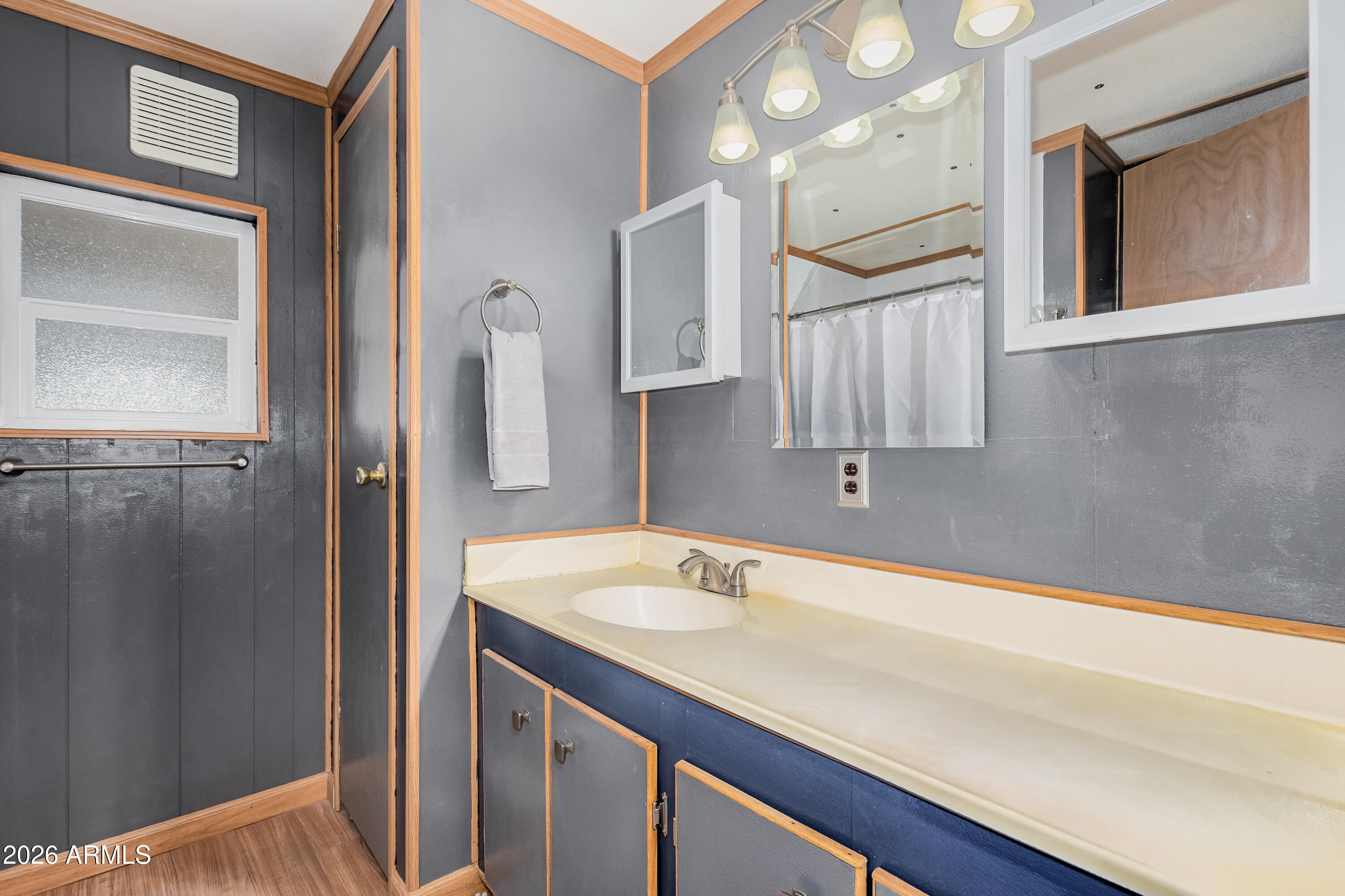 9302 East Broadway Road, Unit 122 Mesa, AZ 85208 - Photo 20 of 30 a bathroom with a sink and a mirror