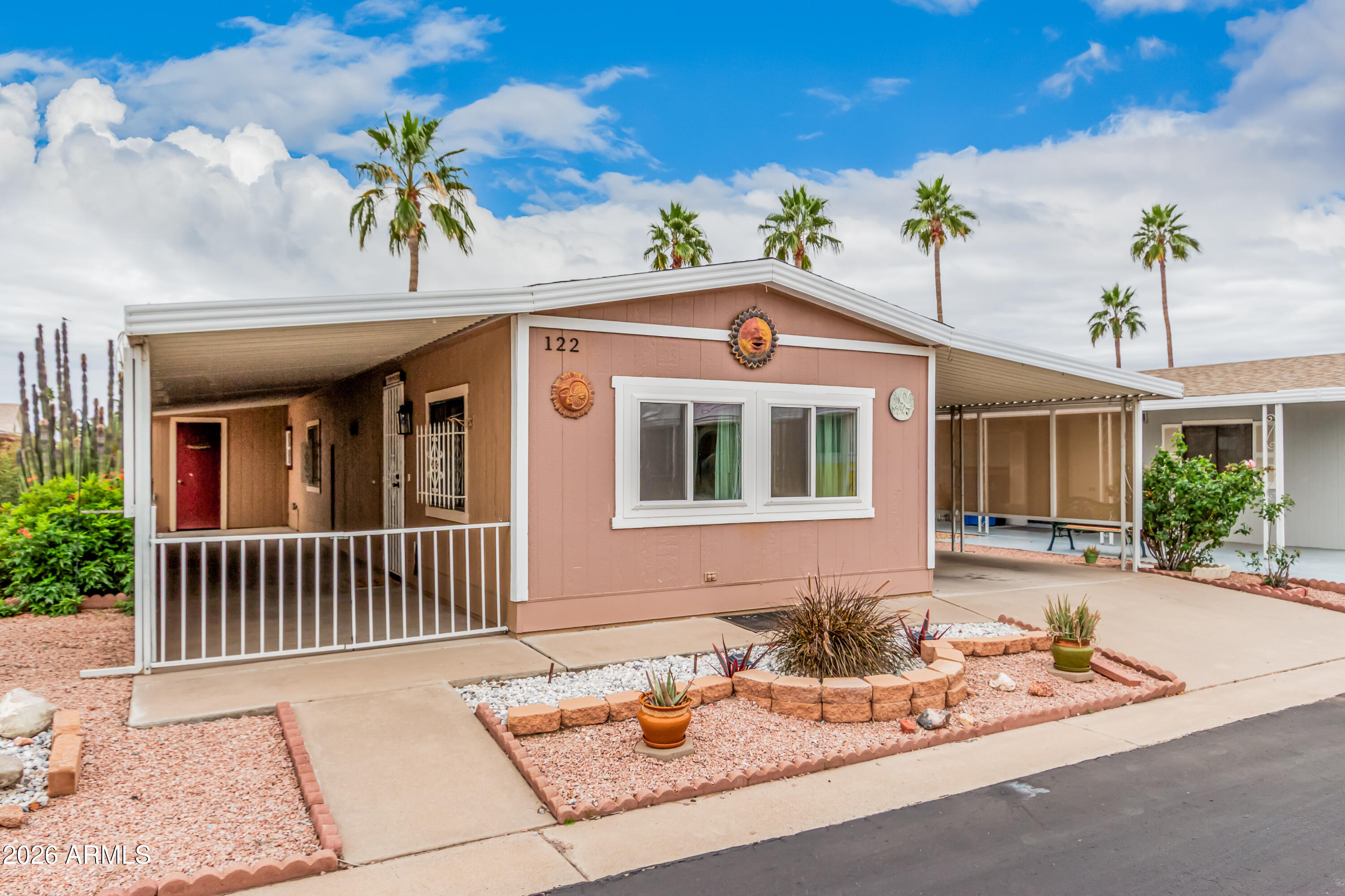 9302 East Broadway Road, Unit 122 Mesa, AZ 85208 - Photo 3 of 30 a front view of a house with a patio