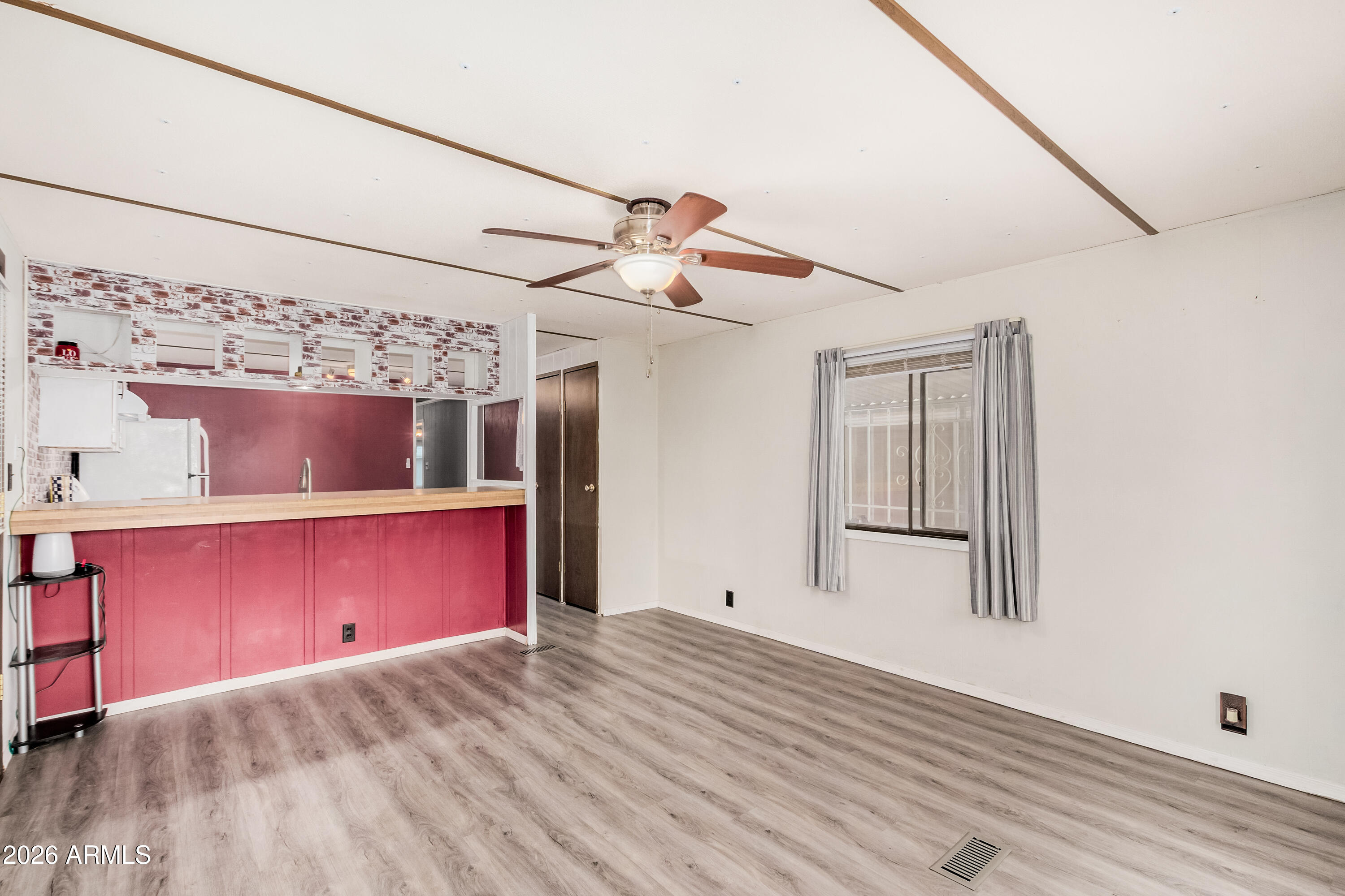 9302 East Broadway Road, Unit 122 Mesa, AZ 85208 - Photo 10 of 30 a view of a room with a ceiling fan