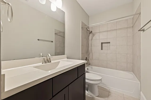a view of a backyard with large trees and wooden fence