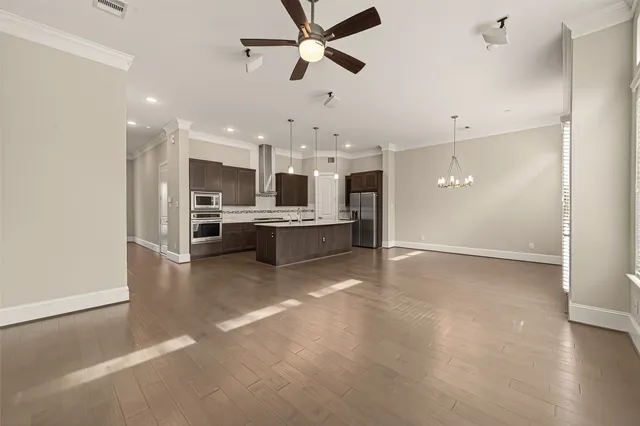 a view of a kitchen with a stove cabinets and wooden floor