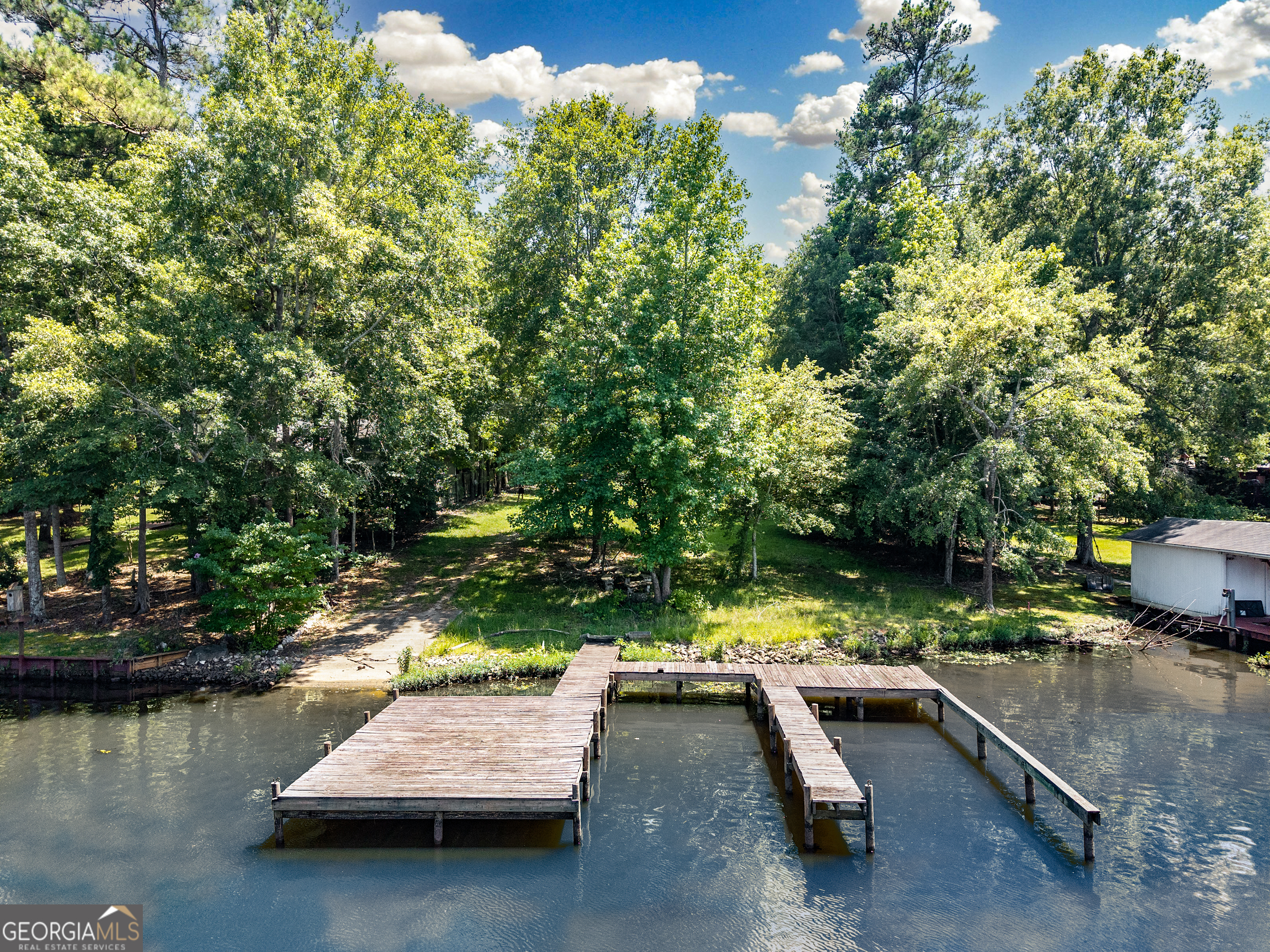 909 South Steel Bridge Road Eatonton, GA 31024 - Photo 1 of 18 a view of swimming pool with lounge chair