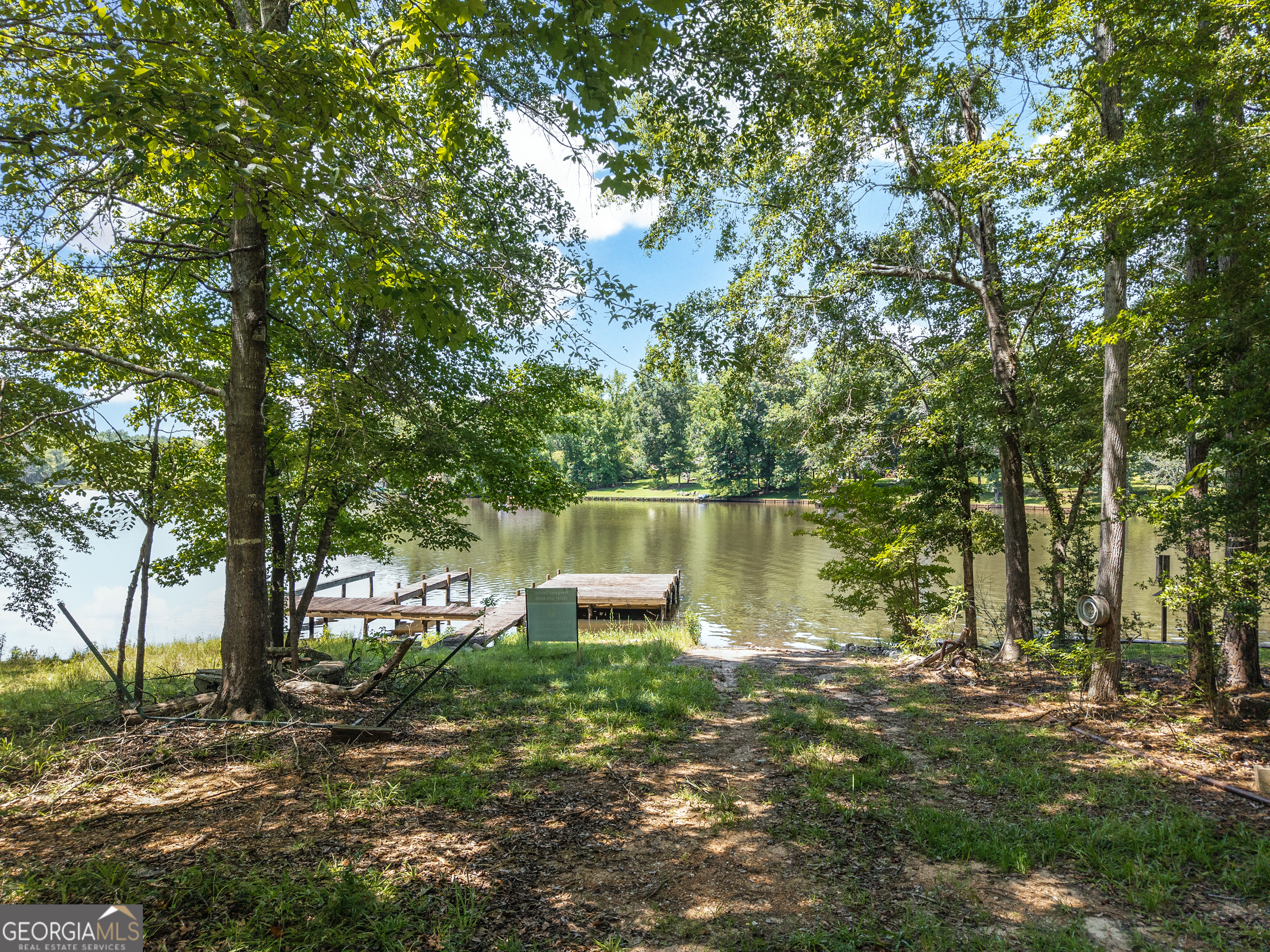 909 South Steel Bridge Road Eatonton, GA 31024 - Photo 11 of 18 a backyard of a house with lots of green space