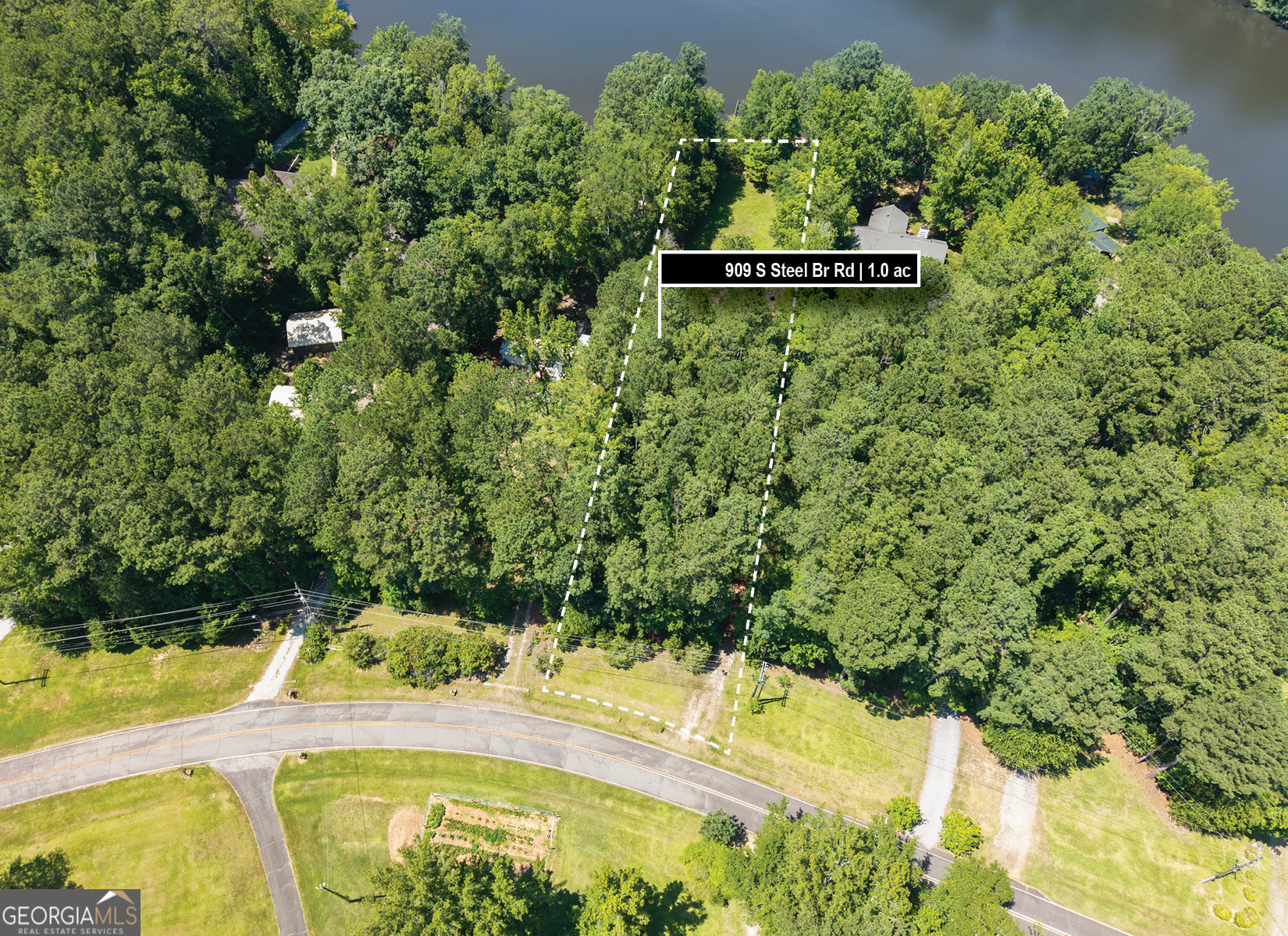 909 South Steel Bridge Road Eatonton, GA 31024 - Photo 5 of 18 a view of a swimming pool with a yard