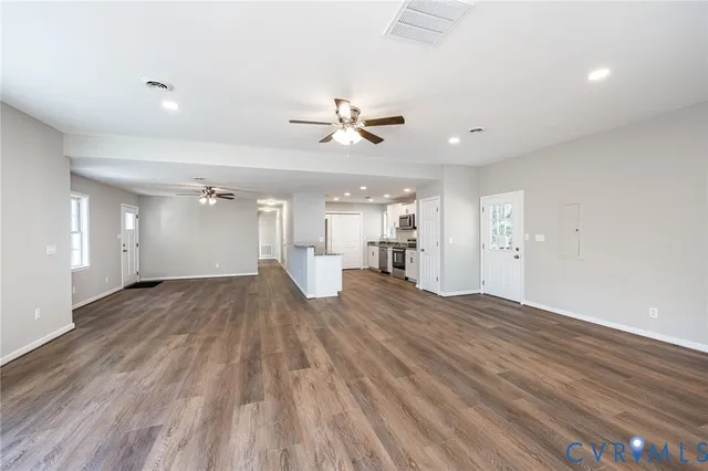 a kitchen with a sink stainless steel appliances and cabinets