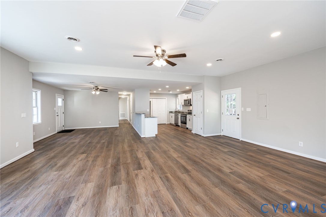 16702 South Crater Road Petersburg, VA 23805 - Photo 11 of 29 a view of a room with a ceiling fan hardwood floor and a ceiling fan