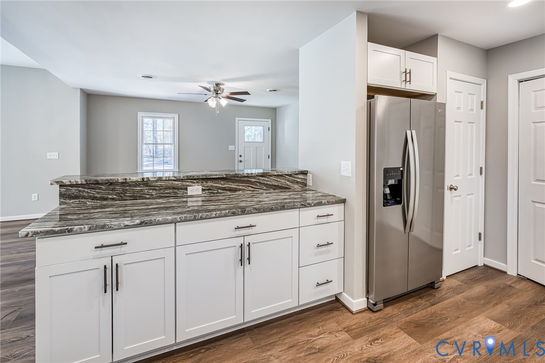 16702 South Crater Road Petersburg, VA 23805 - Photo 16 of 29 a kitchen with stainless steel appliances granite countertop a refrigerator and a stove