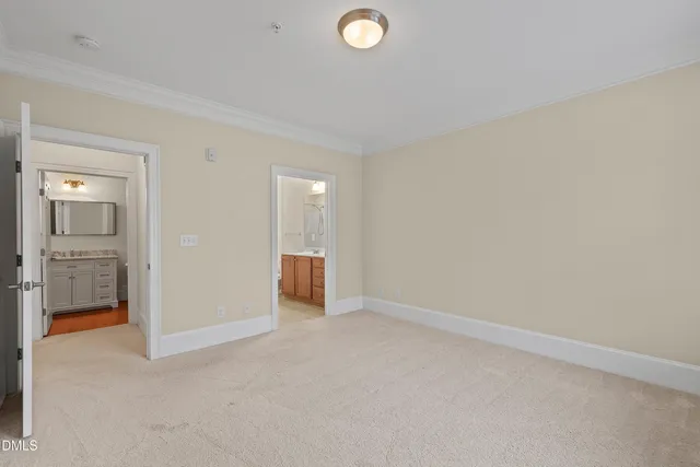 a bathroom with a granite countertop toilet sink mirror and vanity