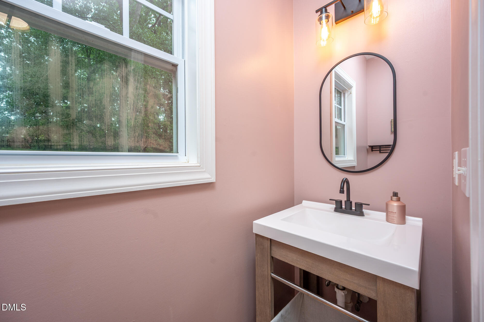 726 Ruth Circle Fuquay-Varina, NC 27526 - Photo 23 of 61 a bathroom with a sink and a mirror