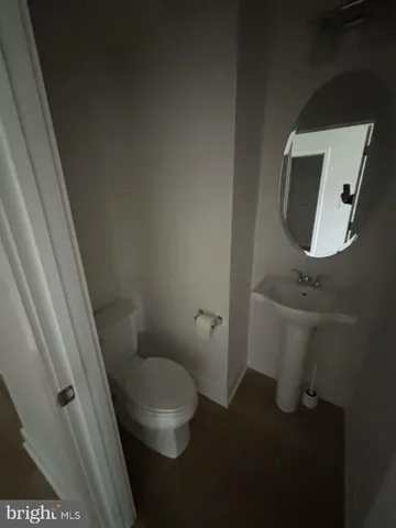 a bathroom with a toilet and a sink