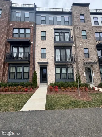 a front view of building with yard