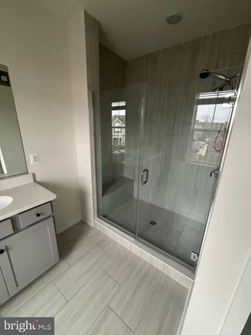 a bathroom with a shower and toilet