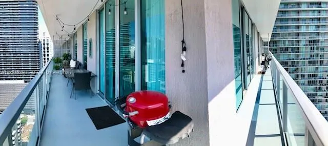 a view of a living room and balcony