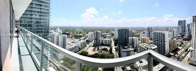 a view of a balcony and city