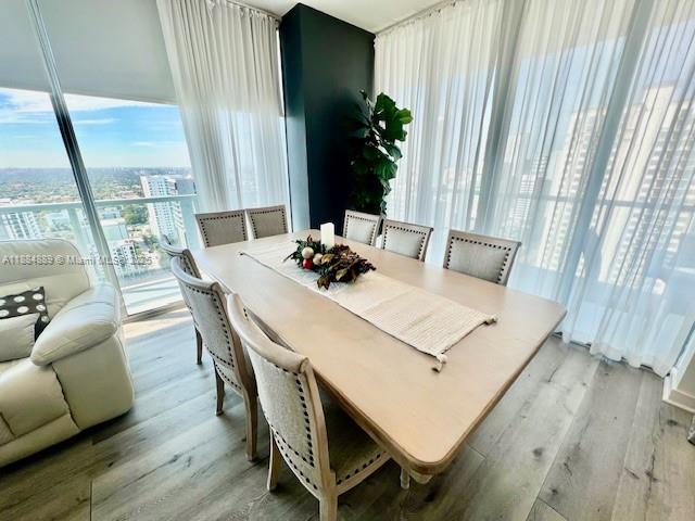 1111 Southwest 1st Avenue, Unit 3225 Miami, FL 33130 - Photo 2 of 24 a living room with furniture and a large window
