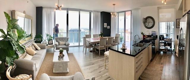 1111 Southwest 1st Avenue, Unit 3225 Miami, FL 33130 - Photo 4 of 24 a living room with furniture and large windows