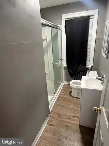 a bathroom with a sink a mirror and a shower