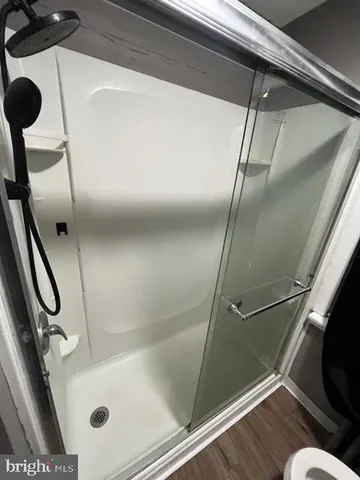 a bathroom with a tub and a shower