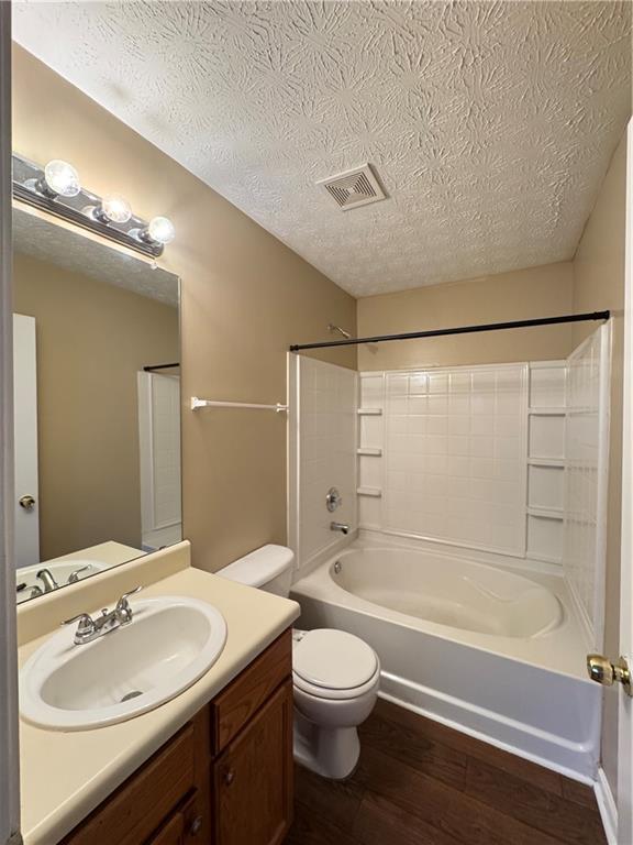 5869 Strathmoor Manor Circle Lithonia, GA 30058 - Photo 2 of 13 a bathroom with a sink a toilet and shower