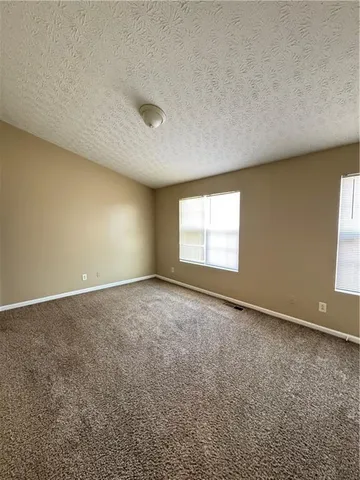 an empty room with a empty space and window