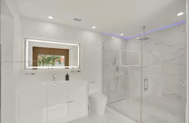 a livingroom with workspace and a couch