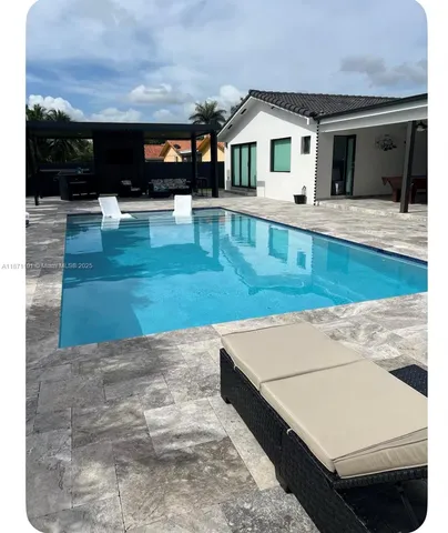 a view of swimming pool outdoor seating