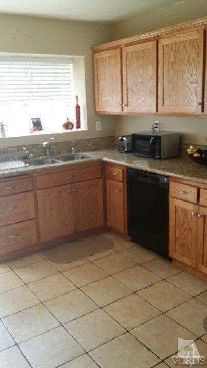 420 Johnson Road Oxnard, CA 93033 - Photo 3 of 9 a kitchen with granite countertop a sink window and cabinets