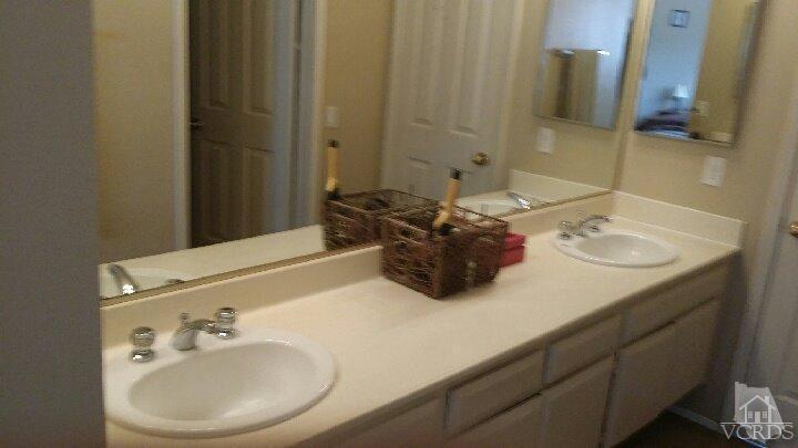 420 Johnson Road Oxnard, CA 93033 - Photo 7 of 9 a bathroom with a sink and a mirror
