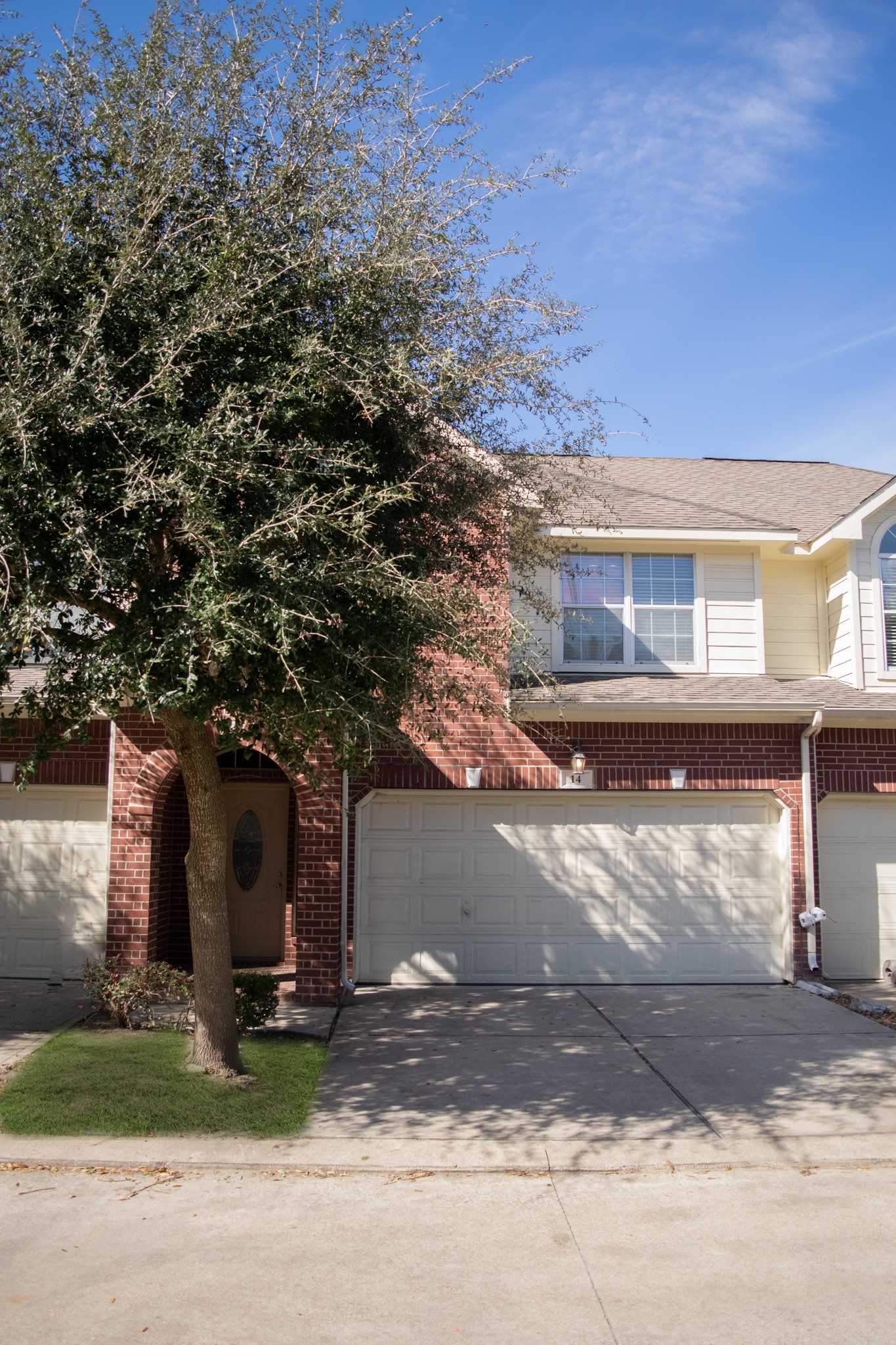 9224 Rodney Ray Boulevard, Unit 18 Houston, TX 77040 - Photo 1 of 27 a front view of a house with a yard