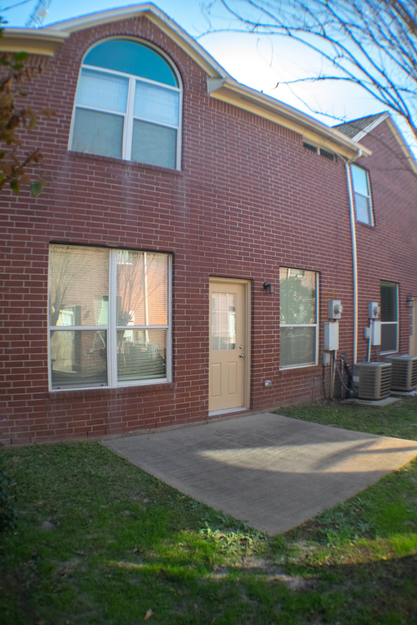 9224 Rodney Ray Boulevard, Unit 18 Houston, TX 77040 - Photo 12 of 27 a front view of a house with a yard