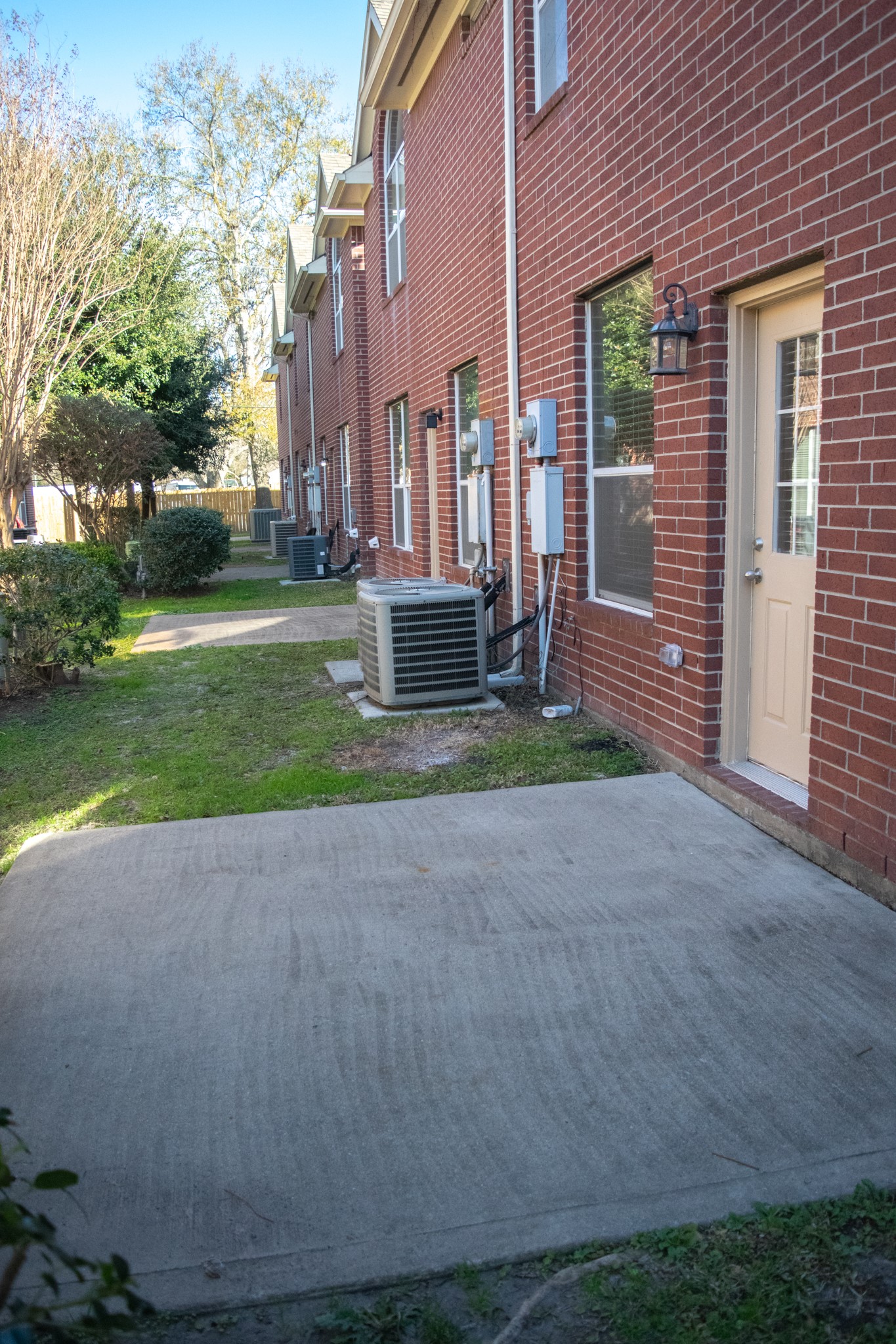 9224 Rodney Ray Boulevard, Unit 18 Houston, TX 77040 - Photo 14 of 27 a view of a house with a yard