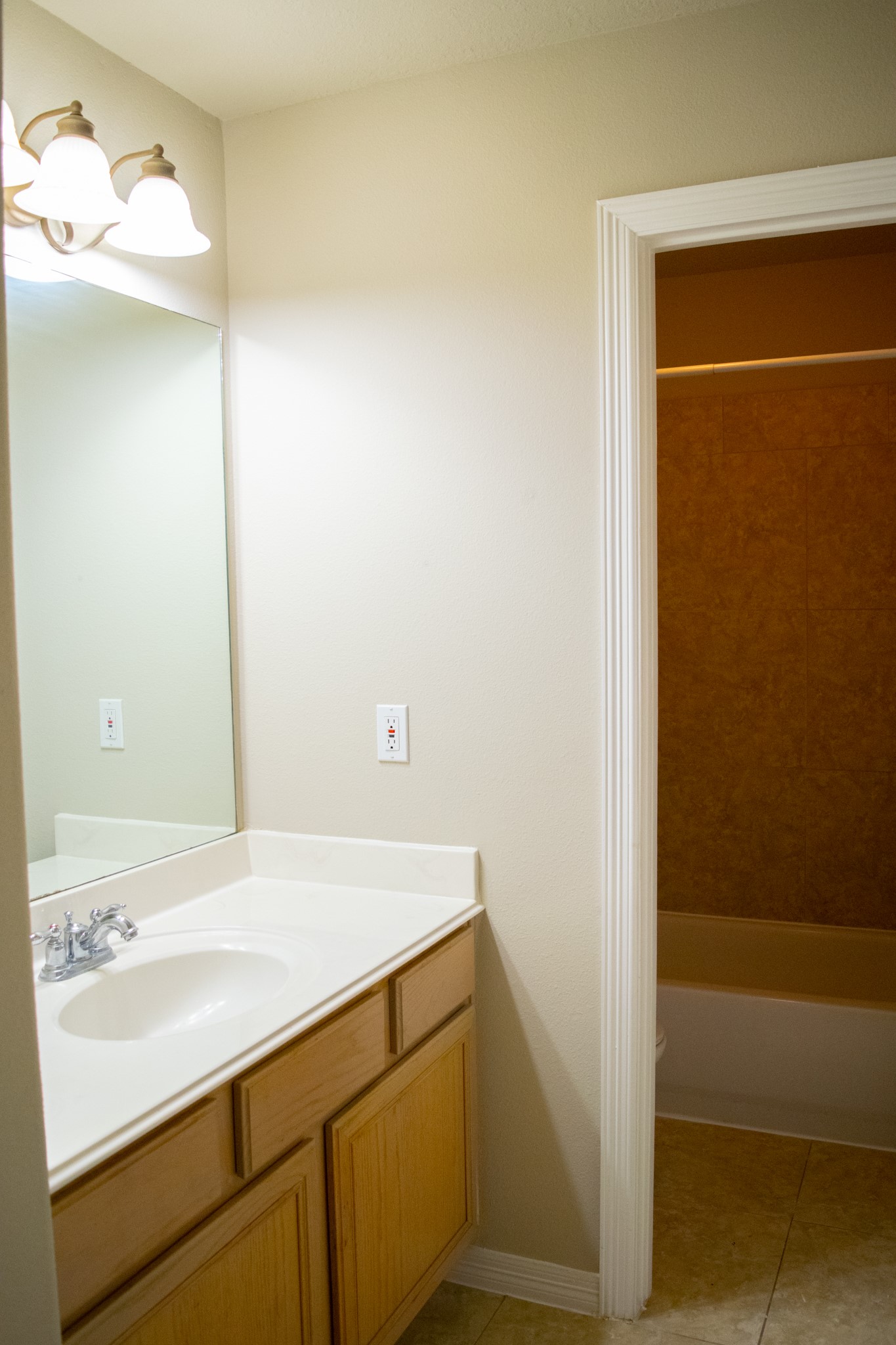 9224 Rodney Ray Boulevard, Unit 18 Houston, TX 77040 - Photo 26 of 27 a bathroom with a sink and a mirror
