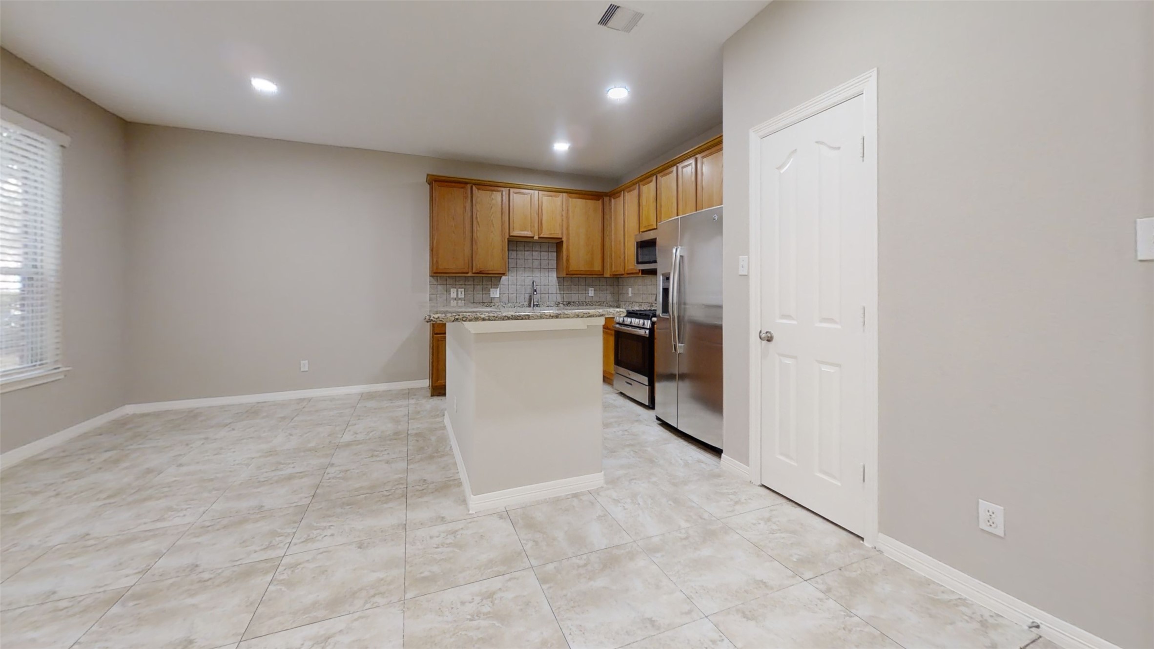 9224 Rodney Ray Boulevard, Unit 18 Houston, TX 77040 - Photo 5 of 27 a view of a kitchen with a sink and cabinets