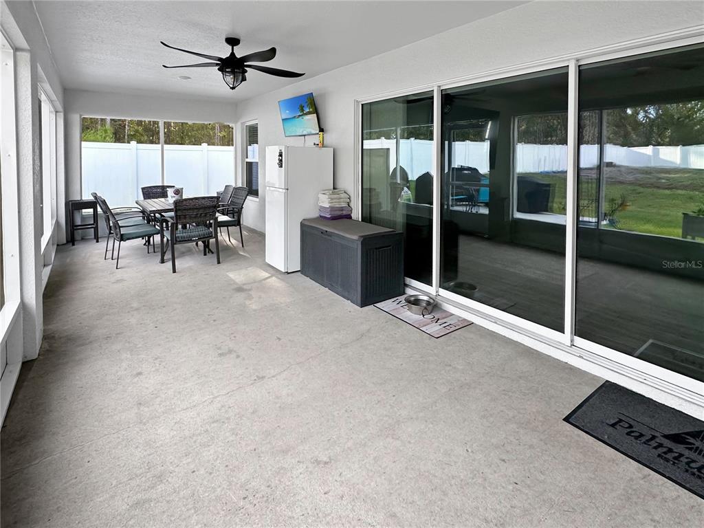 13023 Downy Woodpecker Road Weeki Wachee, FL 34614 - Photo 32 of 43 a view of a livingroom with furniture window and outside view