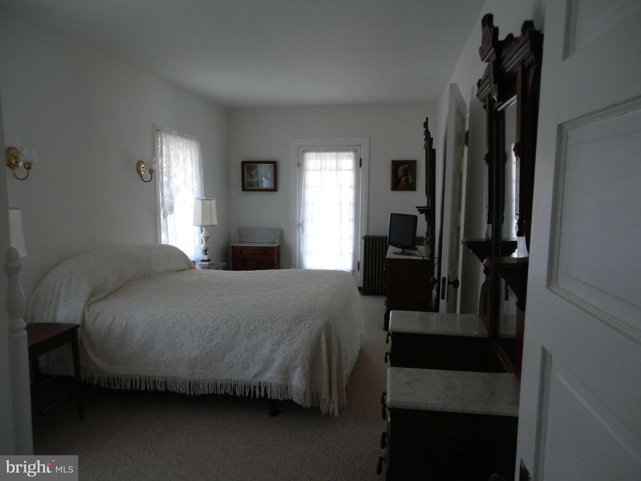 5815 Rowland Hill Road Cascade, MD 21719 - Photo 14 of 30 a bedroom with a bed and a mirror