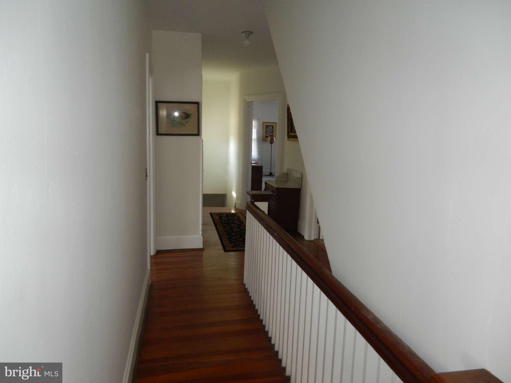 5815 Rowland Hill Road Cascade, MD 21719 - Photo 18 of 30 a view of a hallway with wooden floor