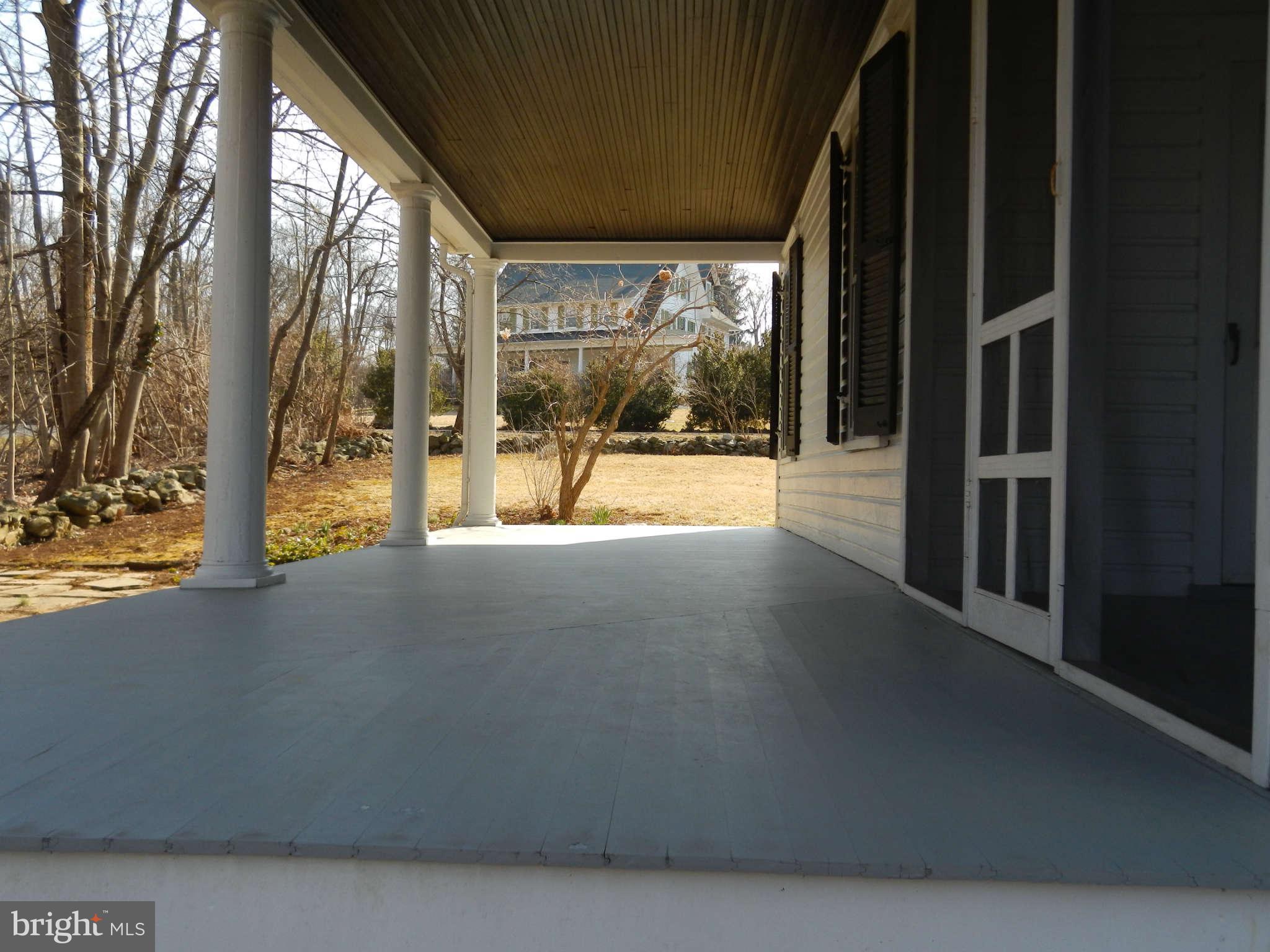 5815 Rowland Hill Road Cascade, MD 21719 - Photo 23 of 30 a view of an empty room with a floor to ceiling window and tree
