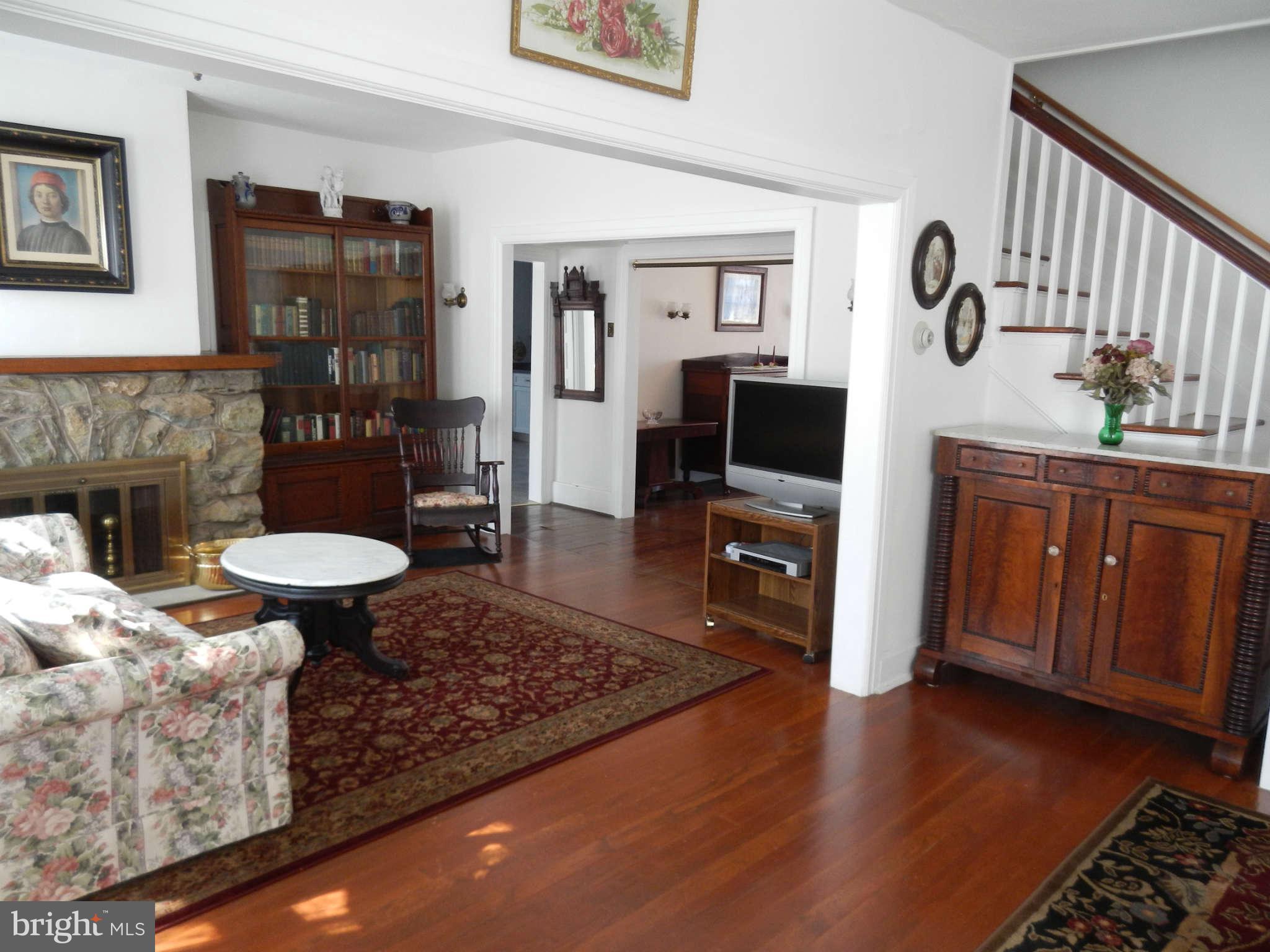 5815 Rowland Hill Road Cascade, MD 21719 - Photo 5 of 30 a living room with furniture and a fireplace