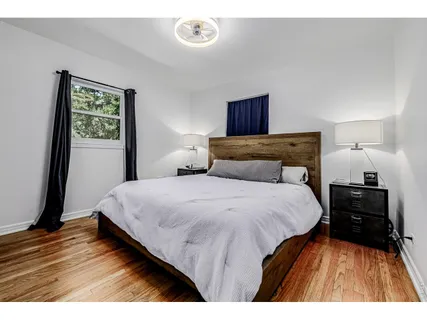 a bedroom with a bed and a dresser