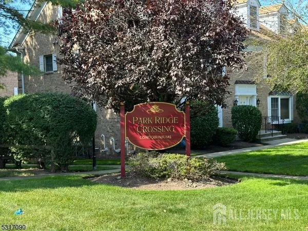 a sign that is sitting in front of a house