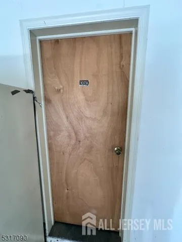 a bathroom with a granite countertop shower and a toilet
