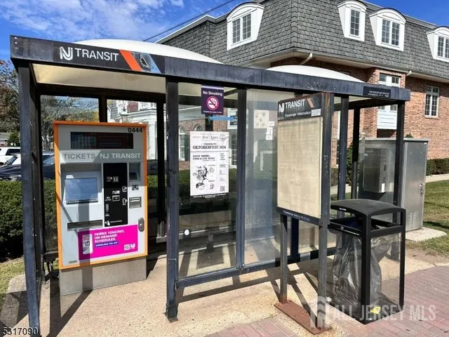 a view of a train that has car parked